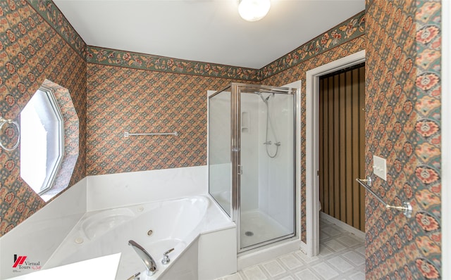 bathroom featuring toilet and separate shower and tub