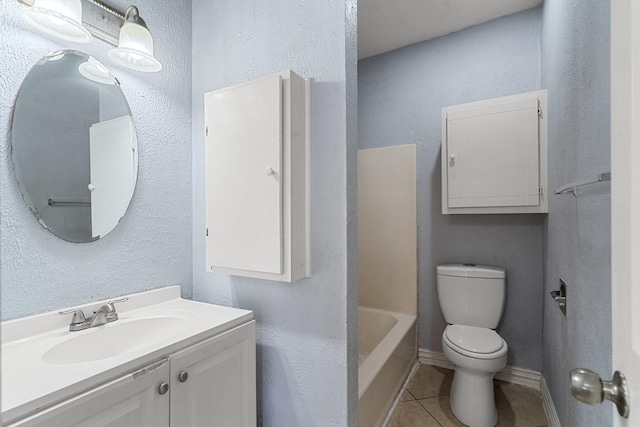 bathroom with tile patterned floors, vanity, and toilet