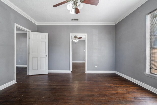 unfurnished room featuring a textured ceiling, dark hardwood / wood-style floors, ceiling fan, and crown molding