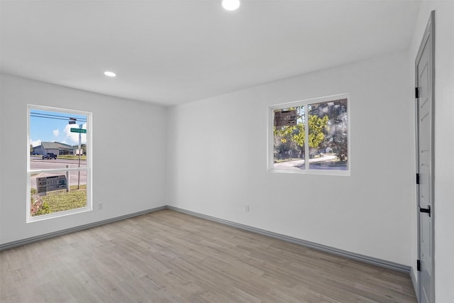 spare room with light wood-type flooring