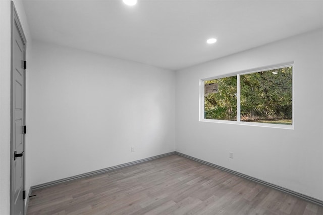 spare room with light hardwood / wood-style floors