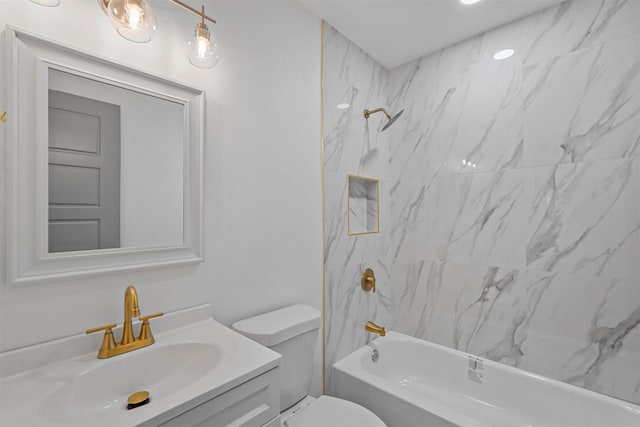 full bathroom with tiled shower / bath combo, vanity, and toilet