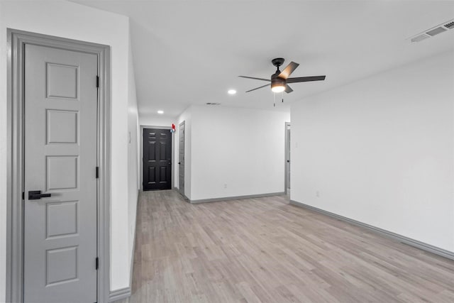 unfurnished room featuring light wood-type flooring and ceiling fan