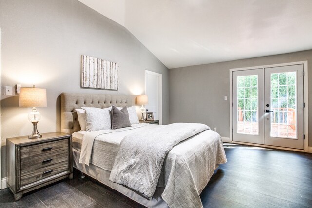 bedroom featuring dark hardwood / wood-style flooring, access to exterior, lofted ceiling, and french doors