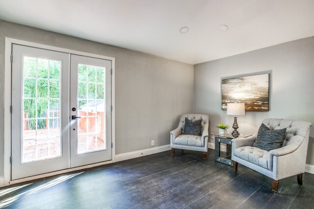 sitting room featuring dark hardwood / wood-style floors and french doors