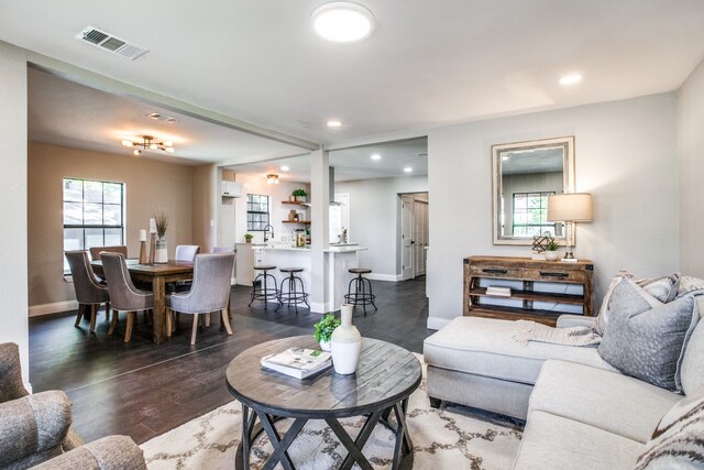 living room with dark hardwood / wood-style flooring