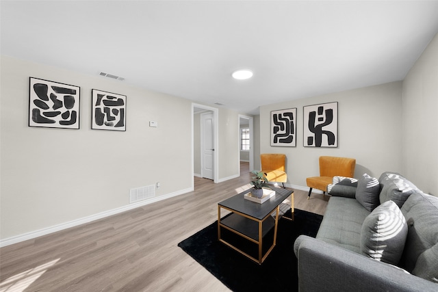 living room with light hardwood / wood-style floors