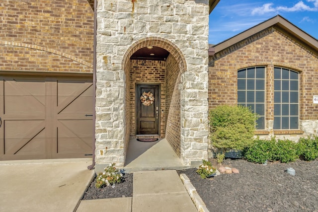 doorway to property featuring a garage