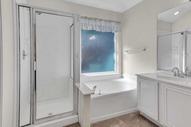 bathroom with vanity and independent shower and bath