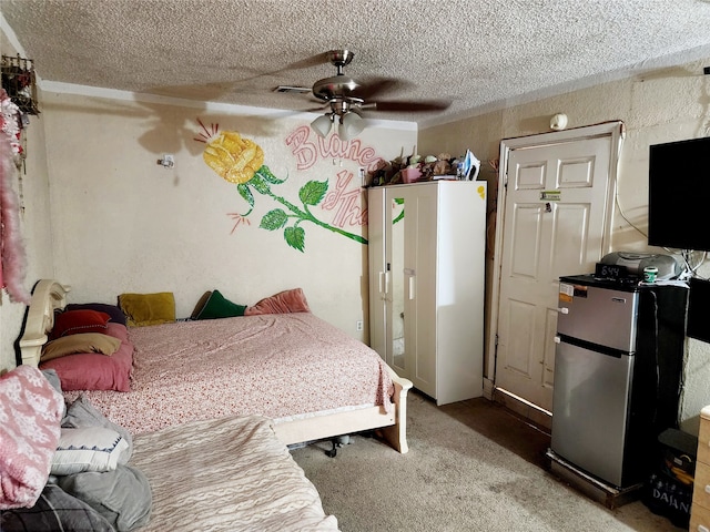 carpeted bedroom with stainless steel fridge, ceiling fan, and a textured ceiling