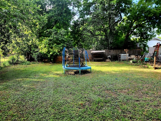 view of yard featuring a trampoline