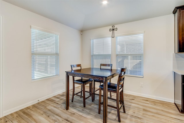 1805 Gold Mine Trl, Aubrey, TX 76227 - dining space with plenty of natural light, lofted ceiling, and light hardwood / wood-style flooring