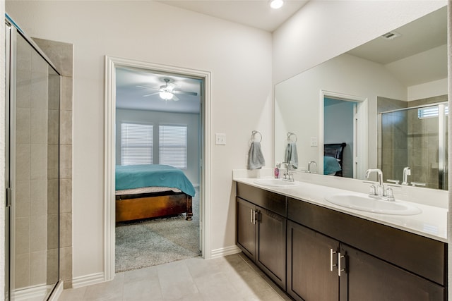 bathroom with ceiling fan, tile patterned flooring, vaulted ceiling, an enclosed shower, and vanity