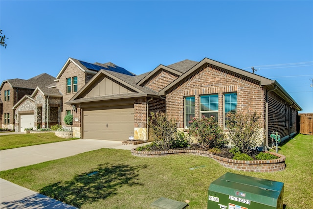 craftsman-style home with a garage and a front lawn