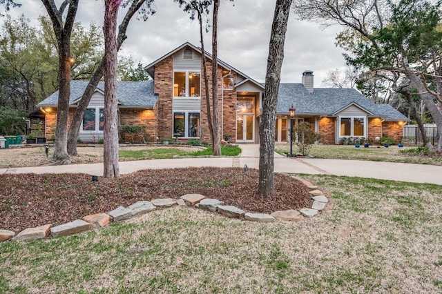 front facade with a front lawn