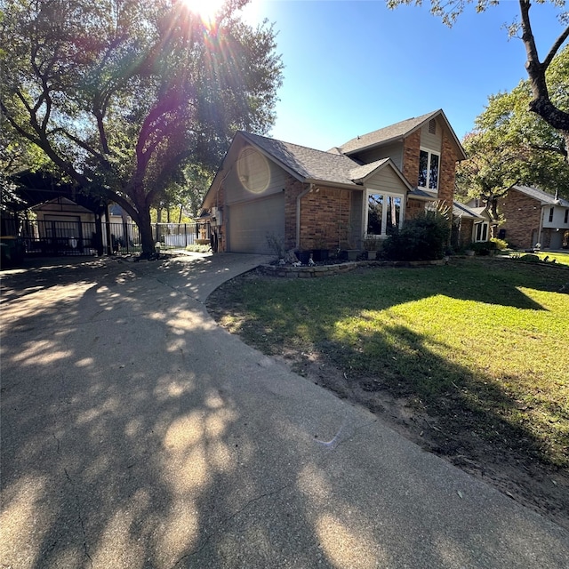 view of front of property with a front yard and a garage