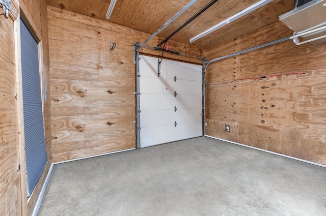 garage featuring wooden walls