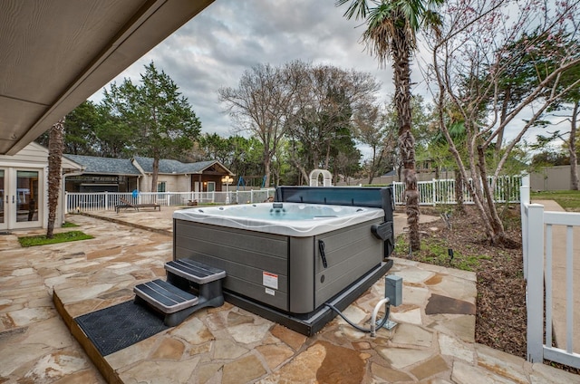 view of patio / terrace with a hot tub