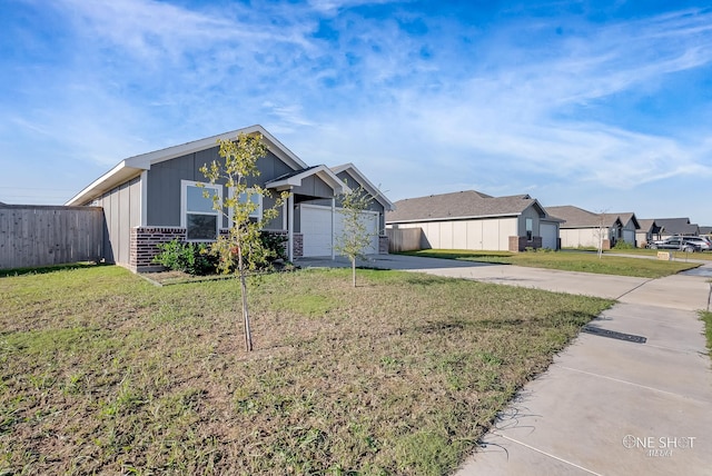 view of front of home with a garage and a front yard