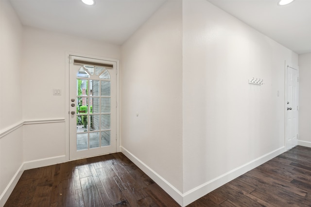 doorway with dark wood-type flooring