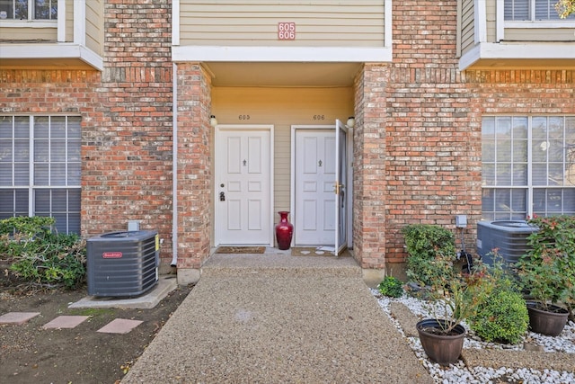 view of exterior entry with central AC unit