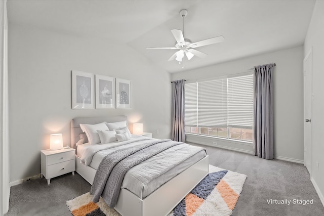 carpeted bedroom featuring ceiling fan and lofted ceiling