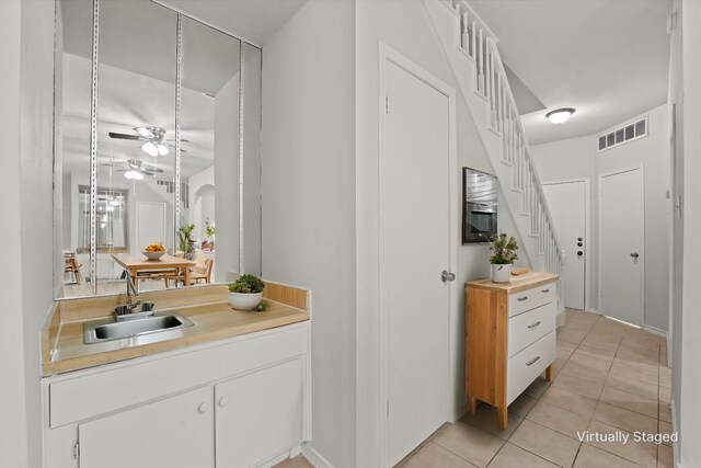 bathroom featuring vanity, tile patterned floors, and ceiling fan