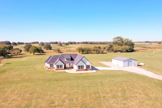 birds eye view of property featuring a rural view