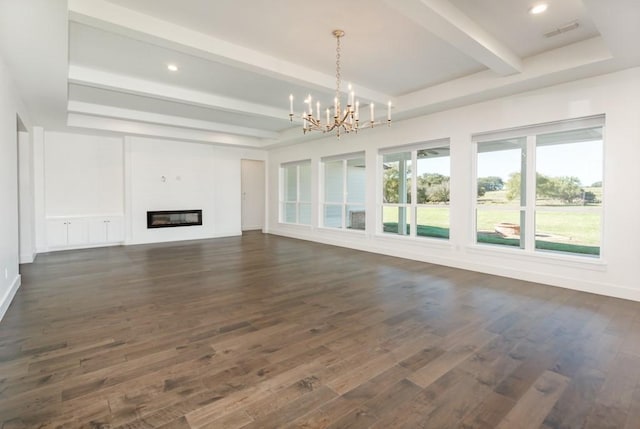 unfurnished living room featuring beamed ceiling, dark hardwood / wood-style floors, and a chandelier