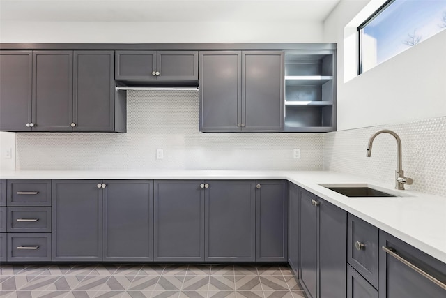 kitchen featuring sink and decorative backsplash