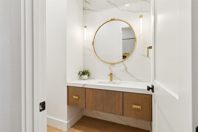 bathroom featuring vanity and wood-type flooring