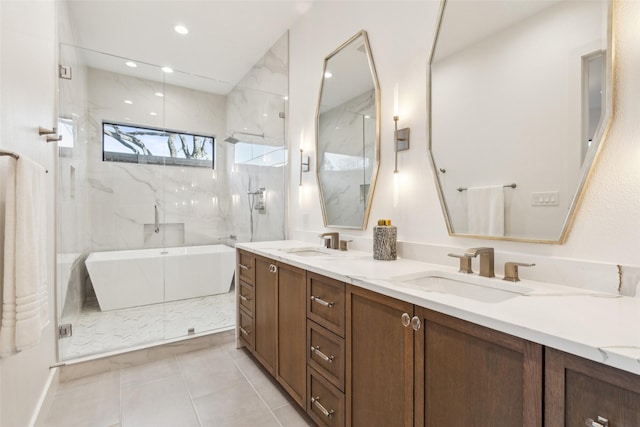 bathroom featuring vanity, tile patterned flooring, and separate shower and tub