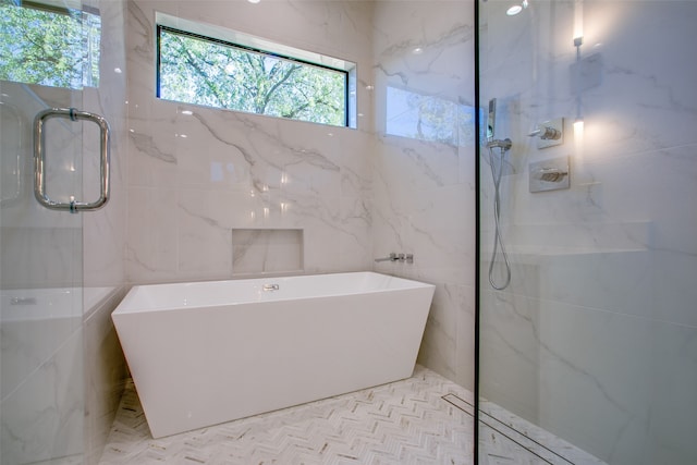 bathroom with a tub to relax in