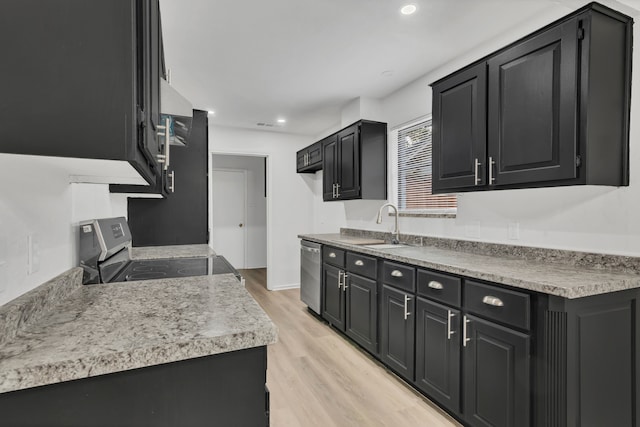 kitchen with light wood-type flooring, sink, and appliances with stainless steel finishes