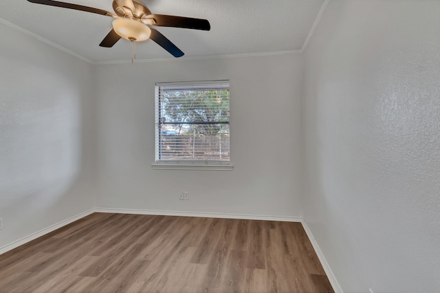 unfurnished room with crown molding, ceiling fan, and light wood-type flooring