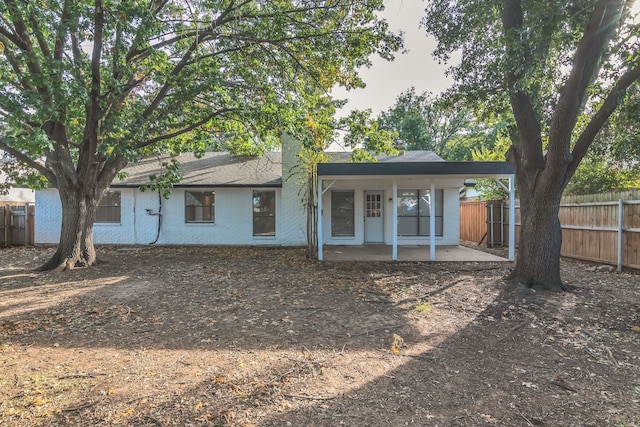 rear view of property with a patio