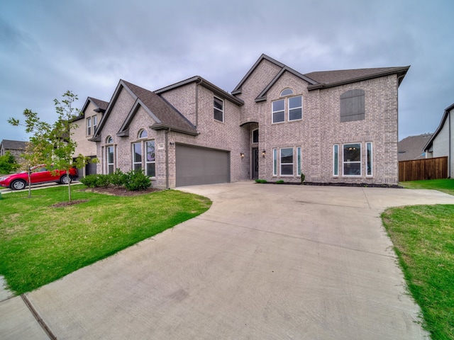 view of front of home featuring a garage and a front lawn