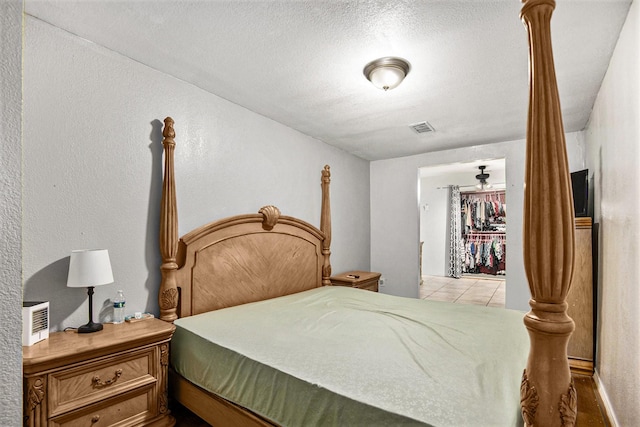 bedroom featuring a textured ceiling