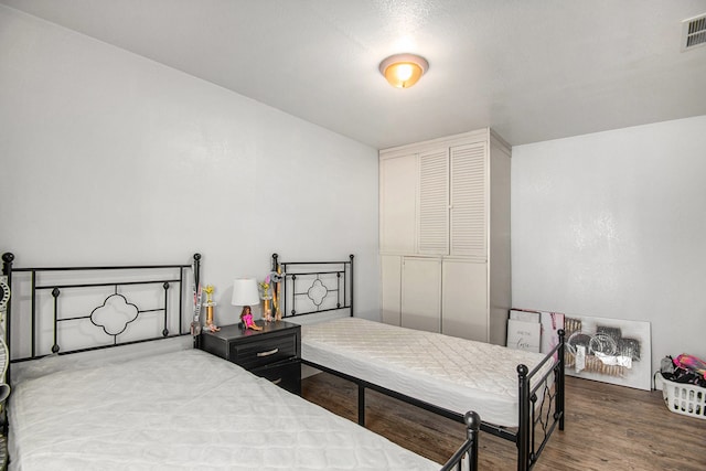 bedroom featuring wood-type flooring