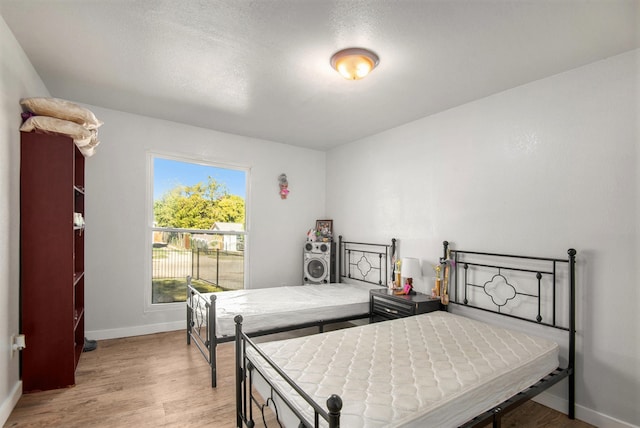 bedroom with light wood-type flooring