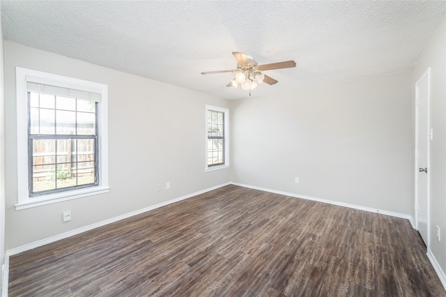 unfurnished room featuring dark hardwood / wood-style flooring and a textured ceiling