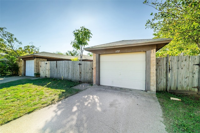 garage featuring a yard