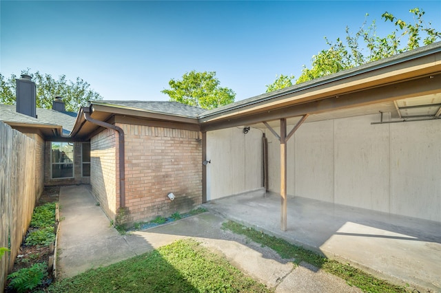 view of side of home with a patio