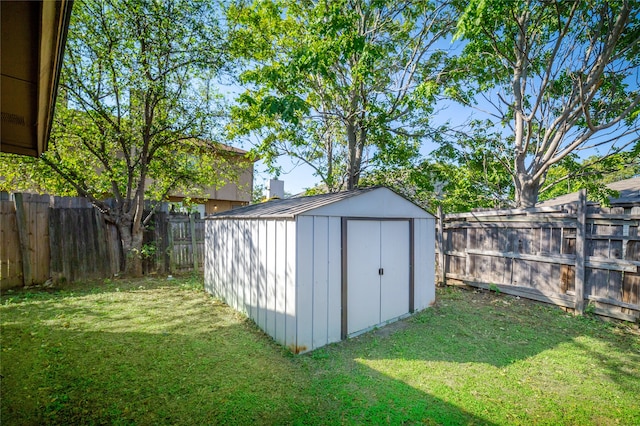 view of outdoor structure featuring a lawn