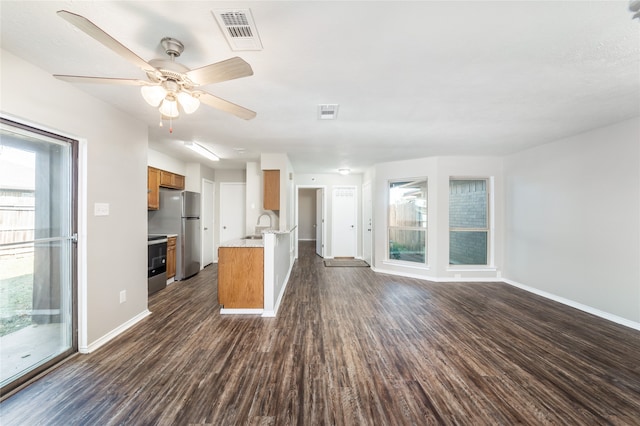 kitchen featuring appliances with stainless steel finishes, ceiling fan, dark wood-type flooring, and sink