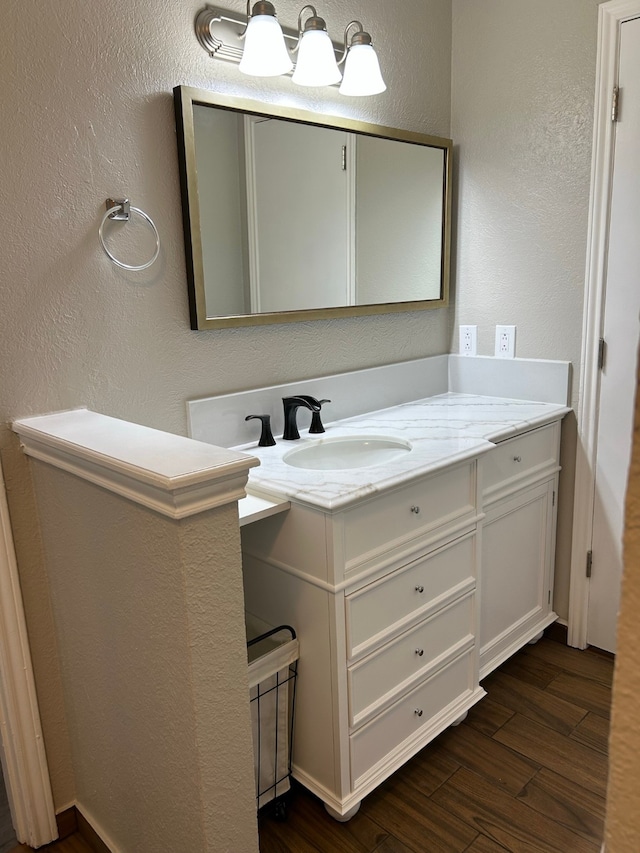 bathroom with vanity and wood-type flooring