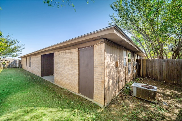 view of outbuilding featuring a yard