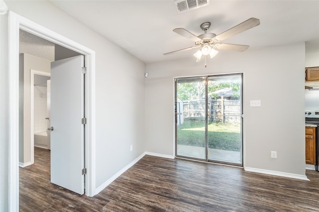 unfurnished room with ceiling fan and dark wood-type flooring