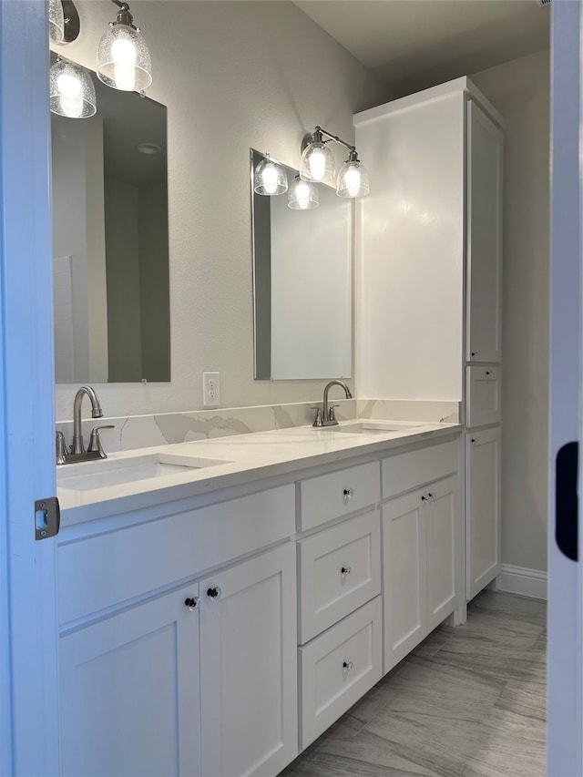 full bath featuring double vanity and a sink