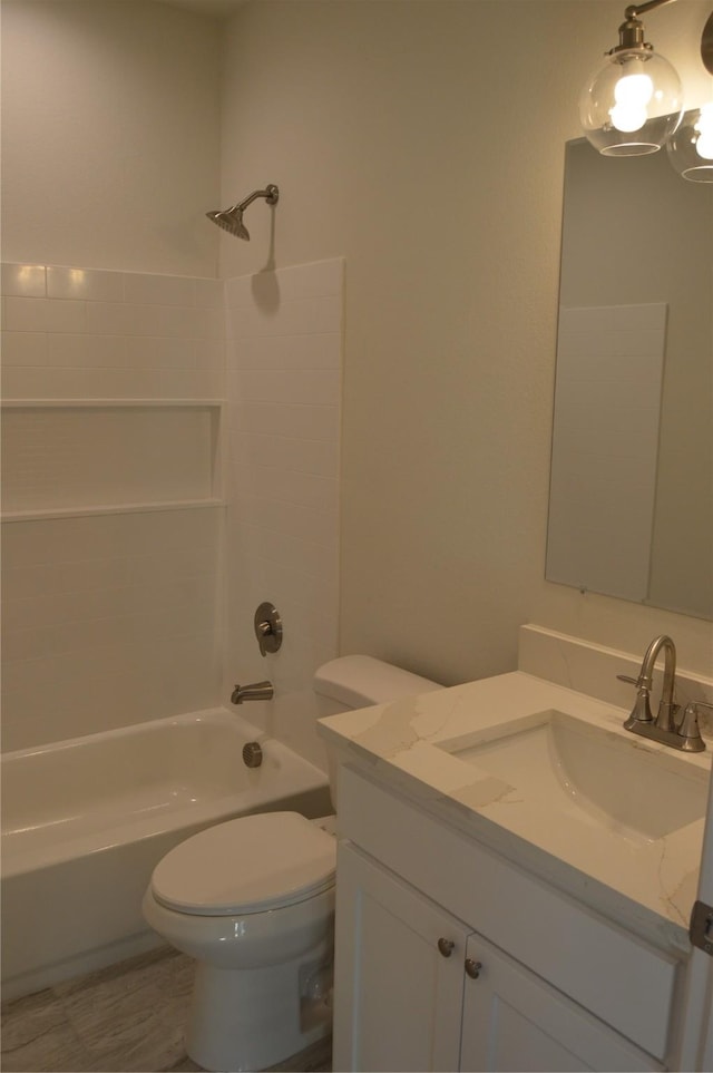 bathroom featuring shower / bathtub combination, vanity, and toilet